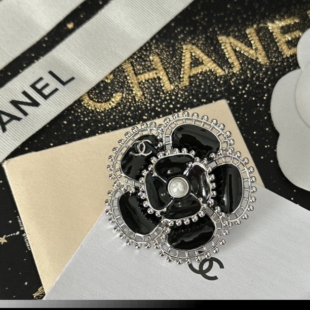 Ch*el brooches